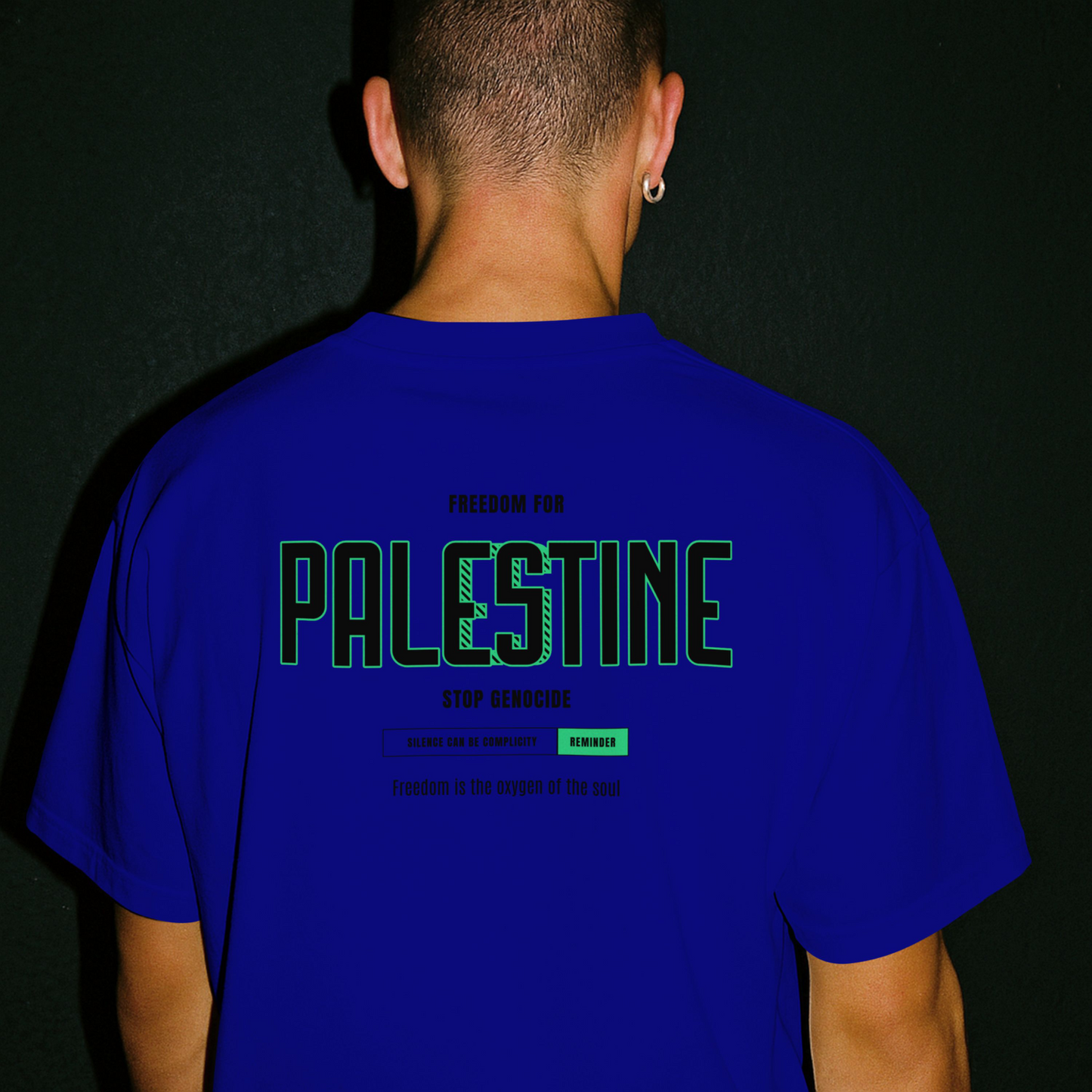 Freedom for Palestine graphic T-shirt in royal blue with black and green text