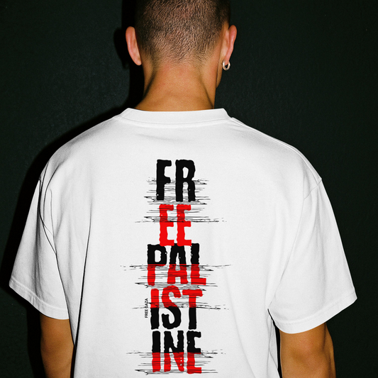 Back view of a person wearing a white t-shirt featuring a vertical “FREE PALESTINE” graphic in black and red distressed text.