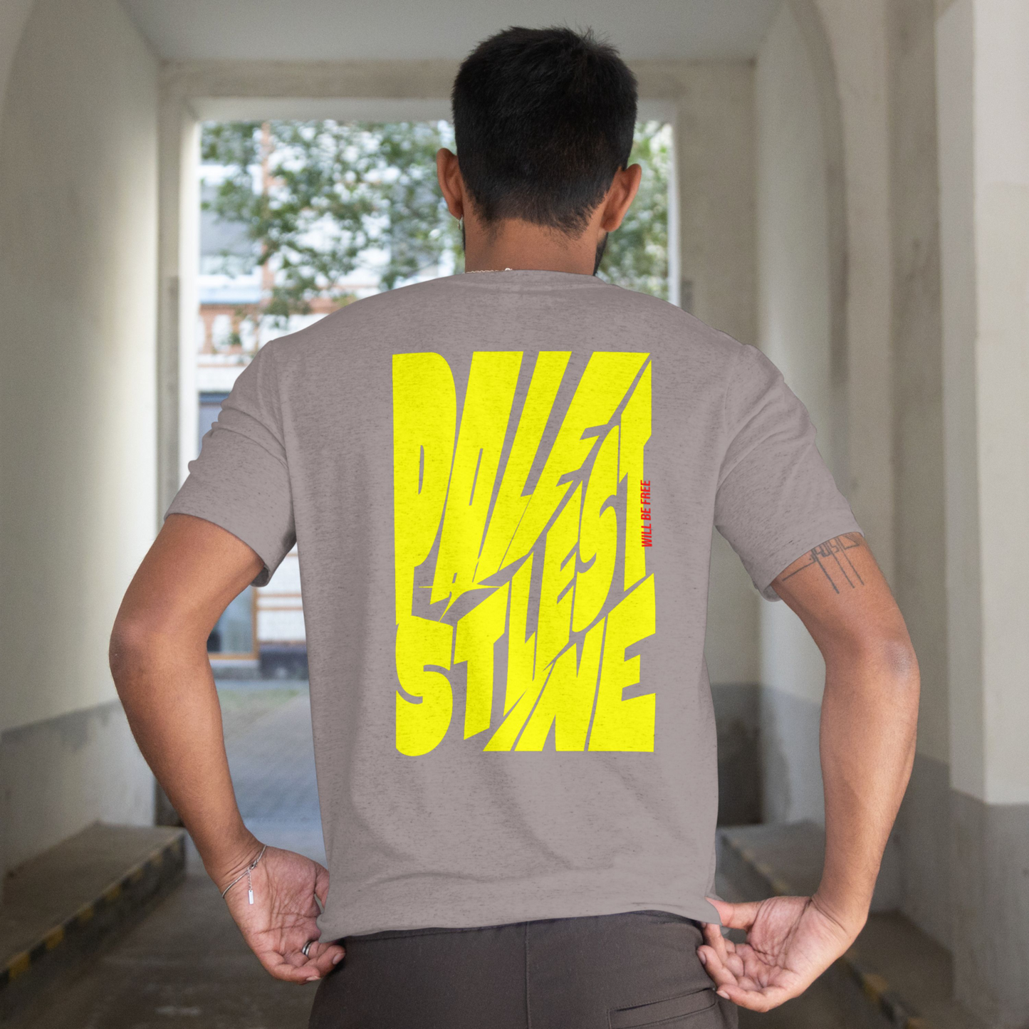 Palestine tee in graphite heather with yellow bold text